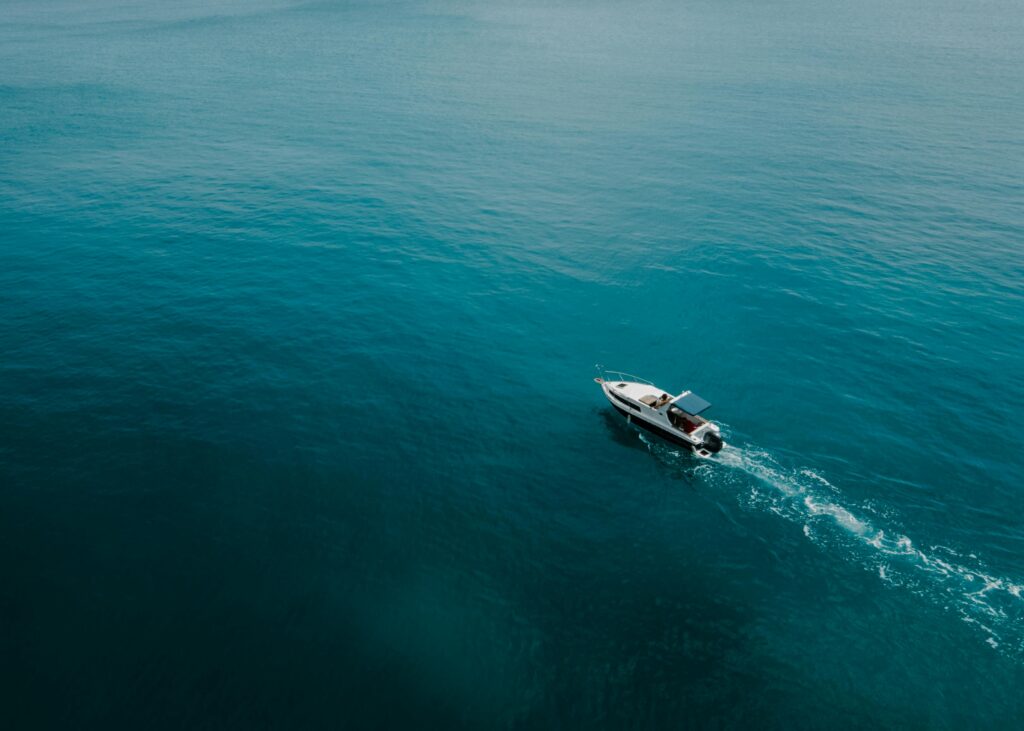 pexels-photo-7599994-7599994 Aerial photo of a motorboat navigating through the vibrant turquoise sea, capturing a sense of adventure.